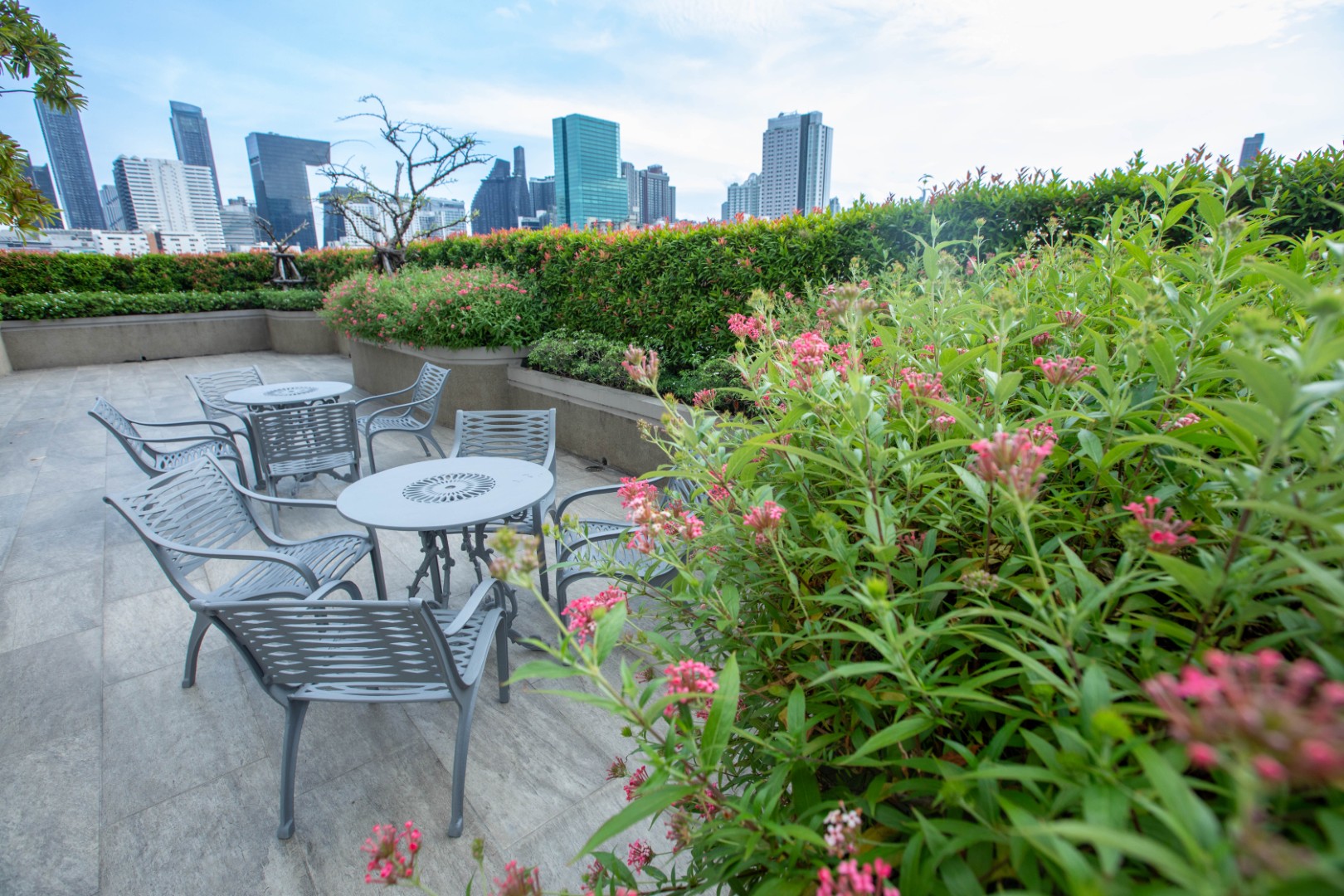 Garden terrace and Bangkok skyline at B.U. Place Hotel